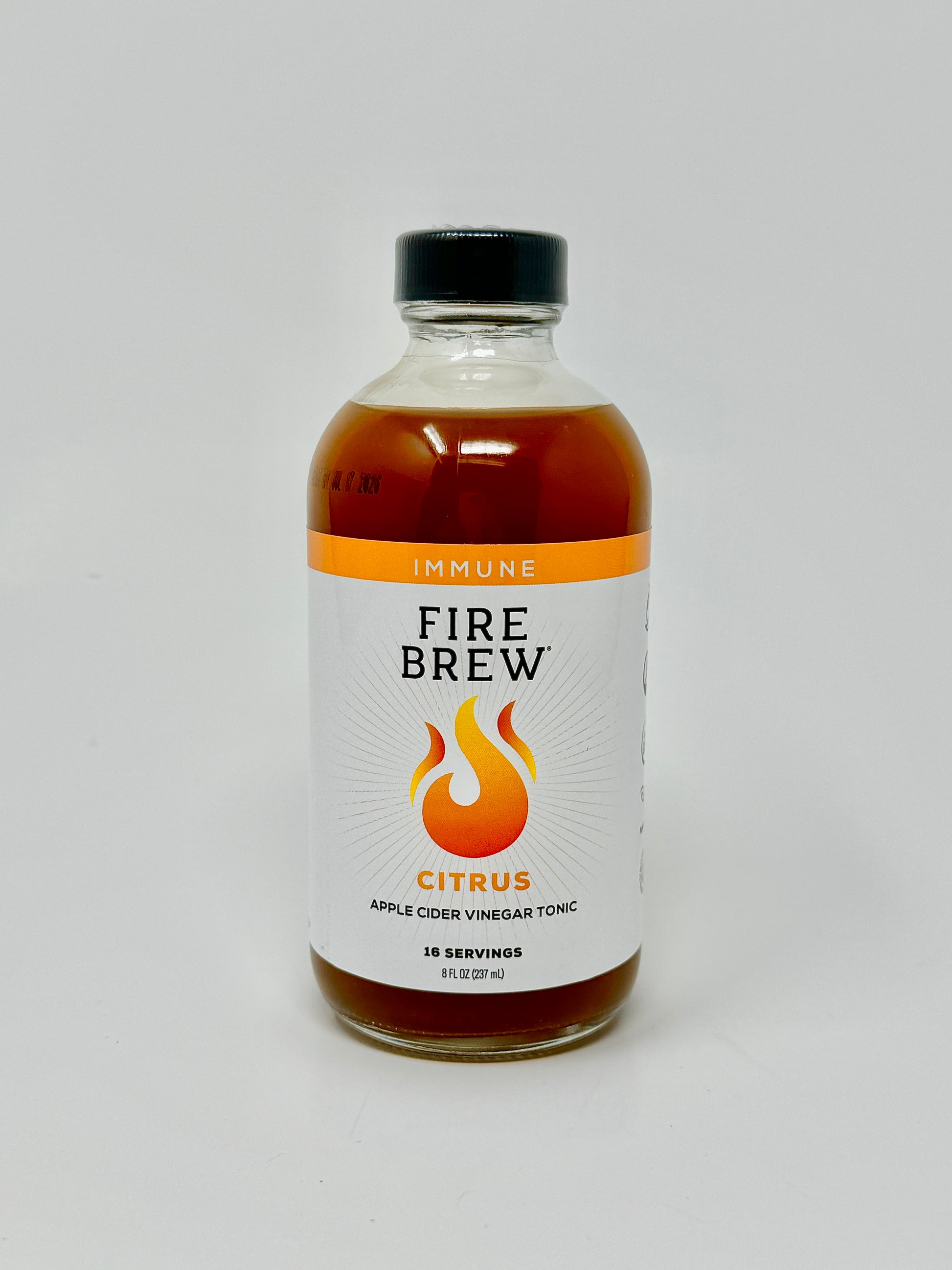 Fire Brew Citrus tonic in an 8 oz bottle made with apple cider vinegar to support daily immune health.