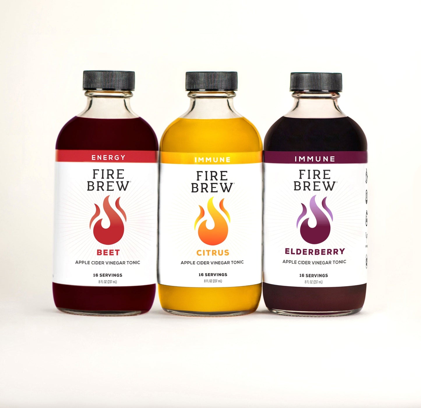 Three Fire Cider apple cider vinegar tonics — Beet, Citrus, and Elderberry — shown in clear bottles.