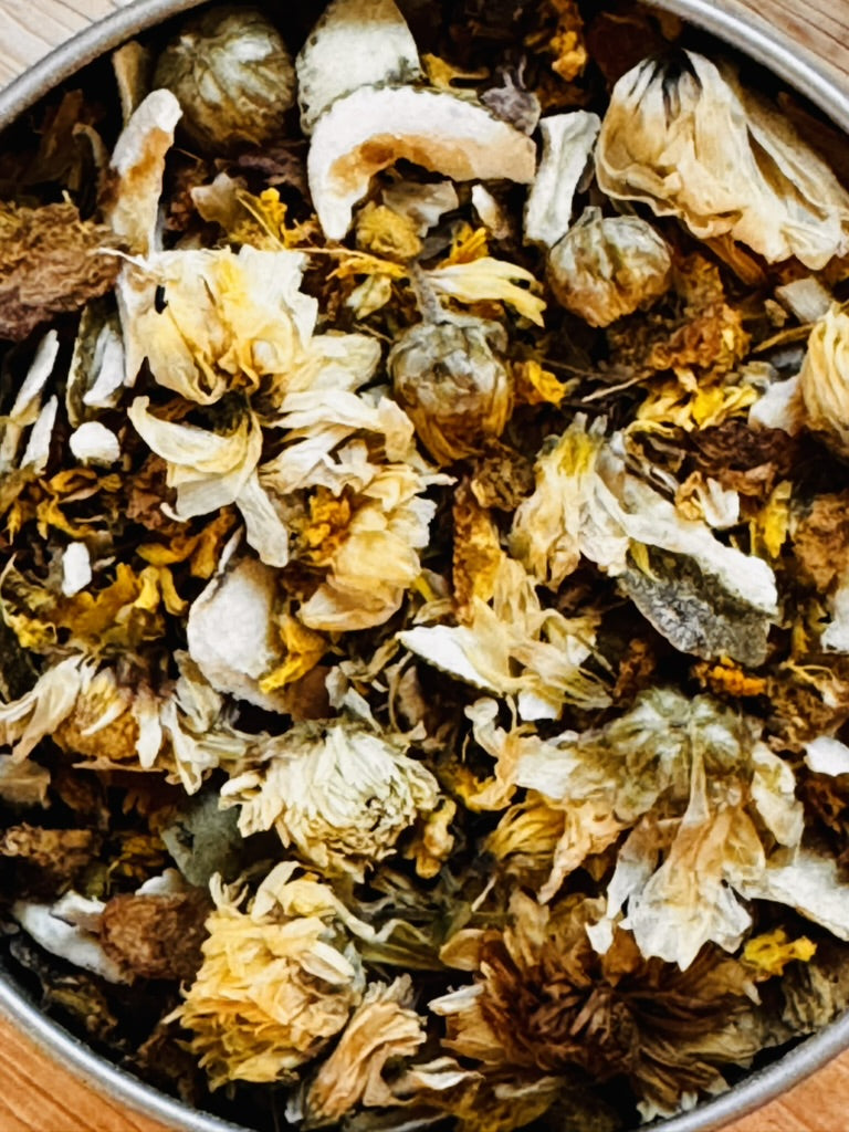 Fire Brew Golden Ember caffeine-free tea blend with dried herbs, flowers, citrus, and spices.