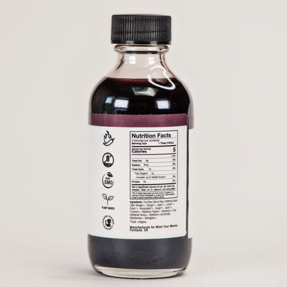 Back view of beet Fire Brew apple cider vinegar tonic showing nutrition facts and all-natural ingredients.